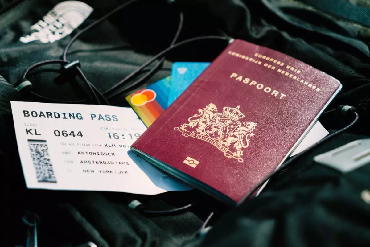 A passport and boarding pass ready for a flight to New Zealand