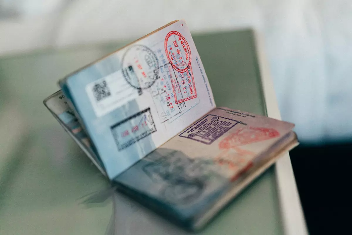 An open passport with entry stamps, ready for an NZeTA application